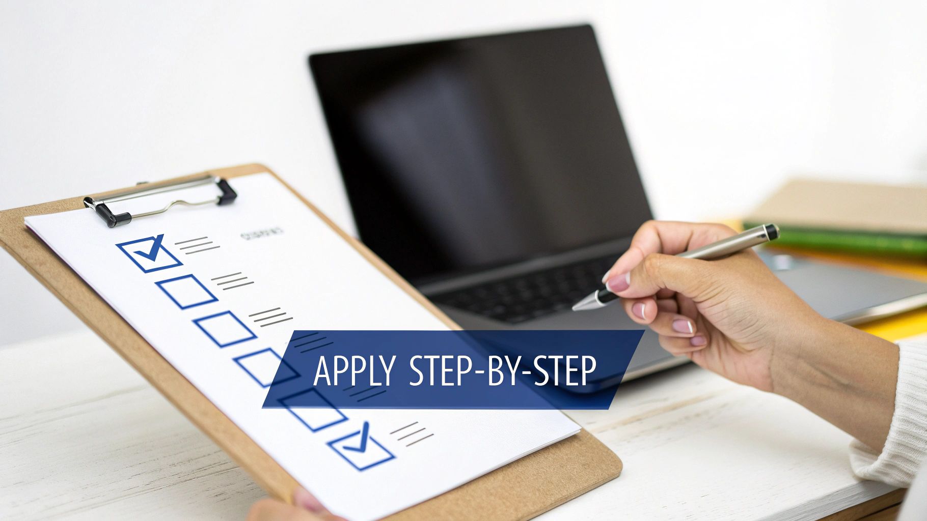 Person holding pen over checklist clipboard with laptop showing step-by-step application process